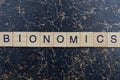 word bionomics from wooden letters in black font