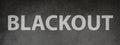 The word blackout is standing on a chalkboard, power cut out Royalty Free Stock Photo