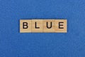 Word blue made from brown wooden letters