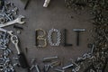 Word Bolt made of old nuts and bolts. Industrial style Royalty Free Stock Photo