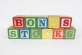 The Word Bonds and Stocks in Wooden Childrens Blocks