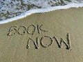 Word book now in the sand Royalty Free Stock Photo