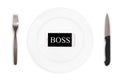 Word boss in the mobile phone on the plate on the white background. Top view.