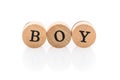 Word Boy from circular wooden tiles with letters children toy. Royalty Free Stock Photo