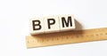 Word BPM made with wood building blocks With Wooden Ruler Royalty Free Stock Photo