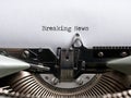 The word breaking news written with a vintage typewriter. Journalism, media information headline Royalty Free Stock Photo