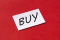 Word buy on a red background. Shopping concept Royalty Free Stock Photo