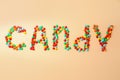 Word Candy made of tasty sweets on beige background, flat lay Royalty Free Stock Photo