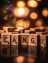 Word cangi is spelled out with wooden cubes on a dark background