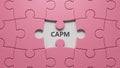 Word capm on puzzle pieces with missing pieces with copy space. Royalty Free Stock Photo