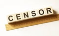Word CENSOR made with wood building blocks