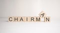 The word chairman is written on wooden cubes on a light background. Business concept