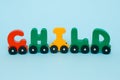 Word child made of letters train alphabet. Bright colors of red yellow green and blue on a white background. Early childhood educa Royalty Free Stock Photo