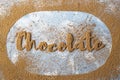 The word chocolate is written in cocoa Royalty Free Stock Photo