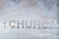 Word Church made with cement letters and cross on grey marble background. Copy space. Biblical, spiritual or christian