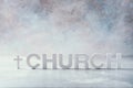 Word Church made with cement letters and cross on grey marble background. Copy space. Biblical, spiritual or christian