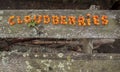 The word cloudberries, written by cloudberries on a wooden boards