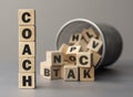 The word COACH made from wooden cubes. Shallow depth of field on the cubes Royalty Free Stock Photo