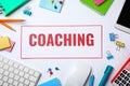 Word COACHING, mobile phone, keyboard Royalty Free Stock Photo