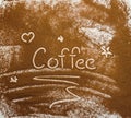 Word coffee handwrite in coffee powder on textured background