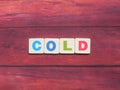 Word Cold on wood