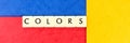 The word Colors on a red, yellow and blue background. Panorama