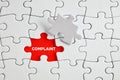 The word complaint on the missing puzzle piece. To discover or expose customer complaints