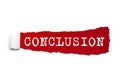 Word conclusion written under the curled piece of Red torn paper