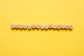 the word Congratulations, text made with dice on yellow background Royalty Free Stock Photo