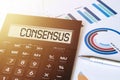 Word CONSENSUS on calculator. Business and finance concept Royalty Free Stock Photo