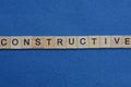 Word constructive from small gray wooden letters