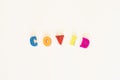 The word Covid inscription on a white background. Coronavirus is a pandemic virus originating in China