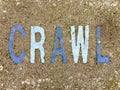 The word CRAWL on the floor in a kids park