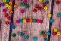 Word created with colored wooden cubes on desk.