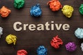Word creative and crumpled colorful paper Royalty Free Stock Photo