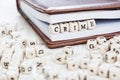 Word CRIME on old wooden table. Royalty Free Stock Photo