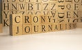 The word crony journalism was created from wooden cubes. Countries and politics Royalty Free Stock Photo
