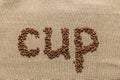 Word ÃÂ«cupÃÂ» of coffee beans Royalty Free Stock Photo