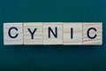 Word cynic made from wooden gray letters