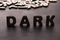 Word Dark standing on table