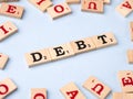 Word DEBT written on wooden cubes stock image.