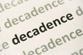 Word decadence printed on paper macro Royalty Free Stock Photo