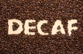 Word Decaf in coffee beans, top view