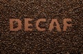 Word Decaf in coffee beans, top view