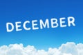 Word December made of clouds steam on blue sky background. Month planning, timetable concept.