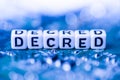 Word DECRED formed by alphabet blocks on mother cryptocurrency