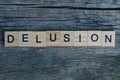 Word delusion made from  wooden letters Royalty Free Stock Photo