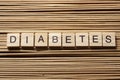 Word diabetes on wooden cubes at wood background