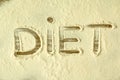 The word `DIET` written on flour