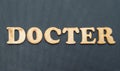 The word Docter on a black background.